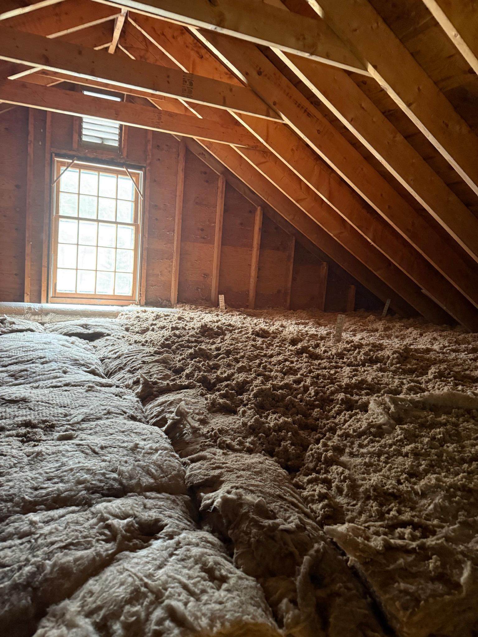 Attic insulation and air sealing area ready for weatherization work